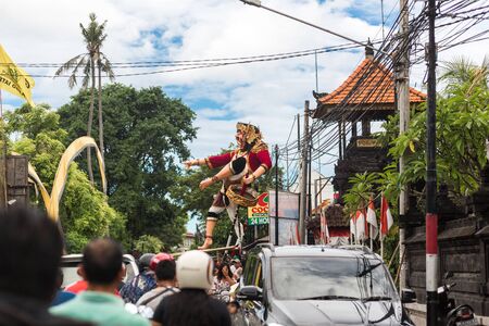 Parade on the street of Bali island. People carry a huge statue of a four-armed demonのeditorial素材