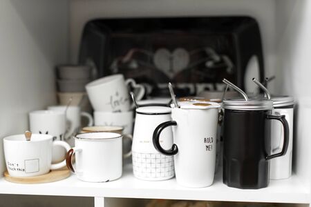 Dishes shop. Stylish mugs for drinks with a strawの写真素材