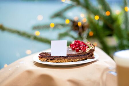 Delicious morning sweet chocolate cupcake dessert on the wooden table, fireflies and spruce...