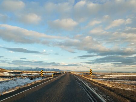 Picturesque winter landscape of Iceland. The perfect road to perspective.