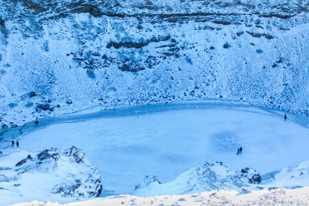 Kerid lake frozen in winter in the crater of an extinct volcano. Incredible iceland landscape in winter.の写真素材