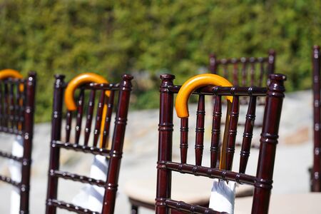 Rows of chairs for guests at an open-air wedding ceremonyの写真素材