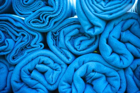 A set of warm blue rugs at an open-air party, in case guests feel cold in the evening.の写真素材