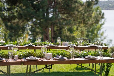 Preparing for an open-air party. Decorated served tables await guests. Decoration Details.