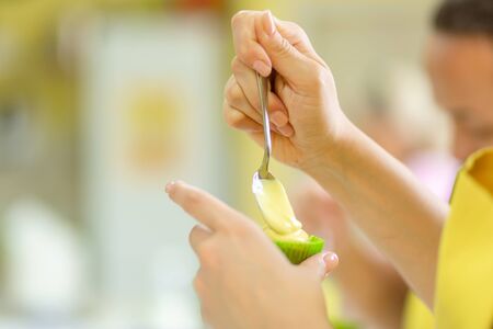 The process of making cupcakes. Creation of cakes by professional pastry chefs.