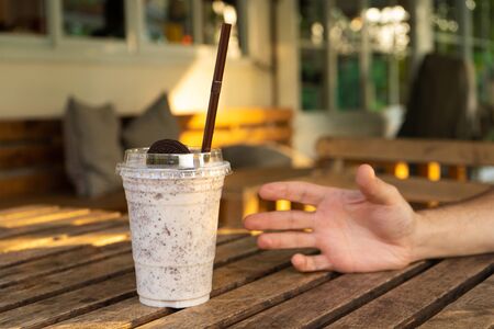 Milkshake with ice cream and oreo cookies. Cool and refreshing on a hot day.の写真素材