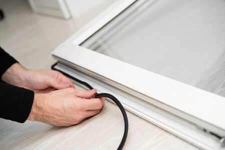 Professional master at repair and installation of windows, changes rubber seal gasket in pvc...