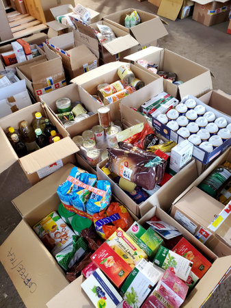 Food humanitarian aid for Ukraine sorted in parcels before sent out to temponary moved persons. Dnipro, Ukraine - 07.04.2022のeditorial素材