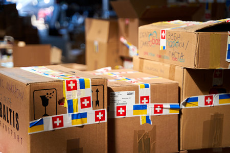 Boxes with humanitarian aid for Ukraine in volunteer center warehouse. Dnipro, Ukraine - 07.06.2022のeditorial素材