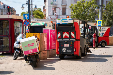 The vehicle washes the streets and cleans the pedestrian zone of the city. Budapest, Hungary - 08.25.2022のeditorial素材