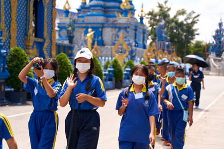 Discovering Thai Culture: School Excursion to a Traditional Temple. Flags of the World at a Ministry Building in Thailand. Chiang Rai, Thailand - 02/09/2022のeditorial素材