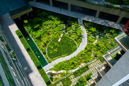 Green garden in the inner yard of residential building complex.の写真素材