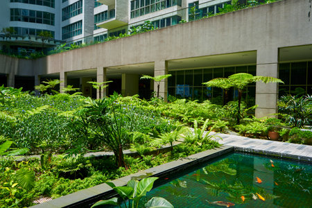 Green garden in the inner yard of residential building complex.の写真素材