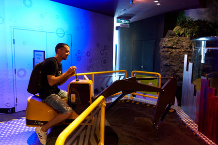 Installation of toy tractor where visitor can dig ground with. Kuala Lumpur, Malaysia - 03.14.2020のeditorial素材