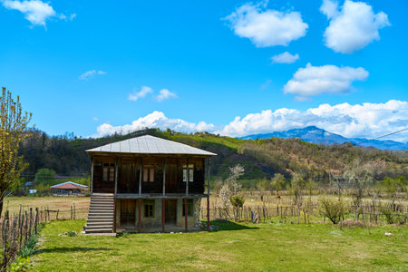 Detached old two-story wooden house. Traditional Georgian house in the village.の写真素材