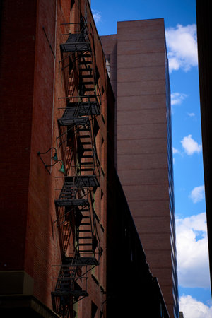 Old fire escape on an old brick wall. American vintage styleの写真素材