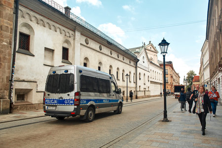 A police van on the ancient streets of Europe. Krakow, Poland - 05.16.2019のeditorial素材