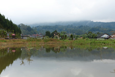 Mountain Lake Bratan in cloudy weather on the popular island of Baliの写真素材