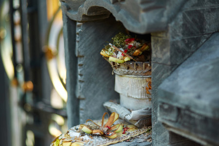 Sculpture of a temple with flowers and incense for ritual offerings on the popular tourist island of Baliの写真素材