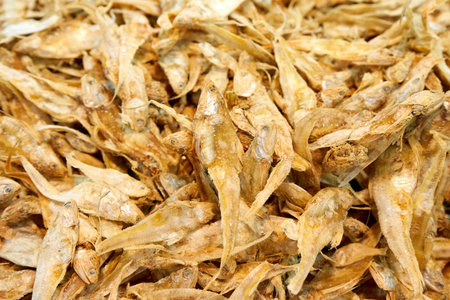 A large assortment of dried fish is on display in the Asian store