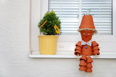 Home decoration, small man made of flowerpotの写真素材