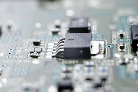 Chip in beautiful blue lighting. Industrial production of circuit boards. High quality photo