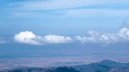 Clouds on the background of mountains in the rays of sunlight. High quality photoの写真素材
