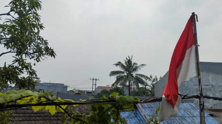 Indonesian flag on the roof of the house in Indonesia.の写真素材