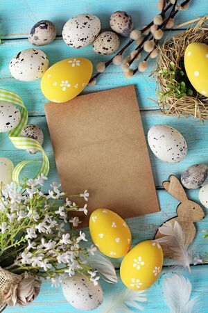 greeting card with colorful easter eggs and spring flowers. mock up frame with copy spaceの写真素材