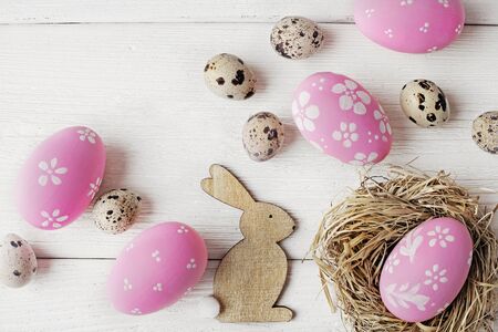 colorful easter eggs on white wooden table