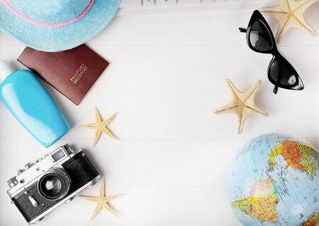 Flat lay traveler accessories on desk with blank space for text. Top view travel or vacation concept. Summer background. Flat lay travel vacation planning and related objects table top empty page text space image.の写真素材