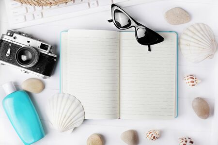 Flat lay traveler accessories on desk with blank space for text. Top view travel or vacation concept. Summer background. Flat lay travel vacation planning and related objects table top empty page text space image.の写真素材