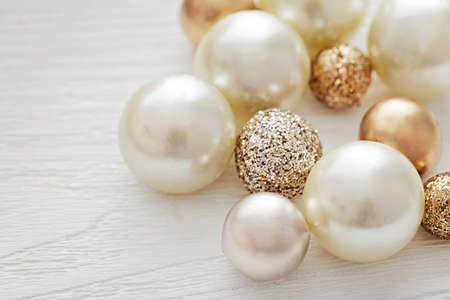 white pearls and golden christmas or wedding beads
