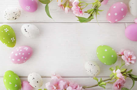 colorful easter eggs and spring flowersの写真素材