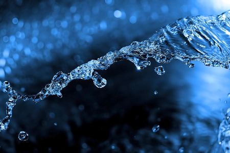 Shot of water splashing and blue dropsの写真素材