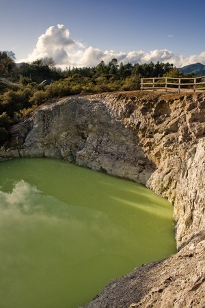 Lake surrounded by rocky heugh, Wai-o-Tapu, Rotorua Volcanic Zone, thermal wonderland  