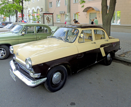 Retro car of USSR of 1960s sedan GAZ M21 Volga on the street on the city central square during the celebration of Victory Dayのeditorial素材
