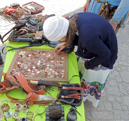 Girl in the tea cosy chooses the bijouterie blacksmith craftsのeditorial素材