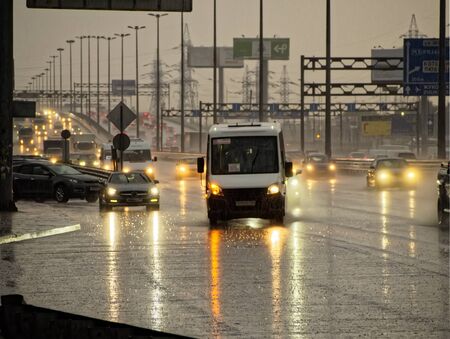 City highway in the evening with cars during the rainの写真素材