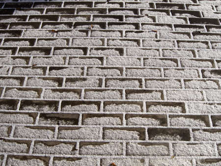 Paving slabs partially covered with snowの写真素材