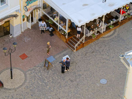 Vitebsk, Belarus - June, 26, 2019: Street cafe on the sidewalk and its visitorsのeditorial素材