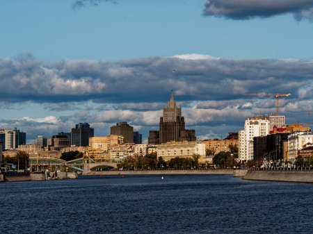 One of the skyscrapers named Seven Sisters and multi-storey residential buildings on the embankment of the Moscow River in Moscowの写真素材