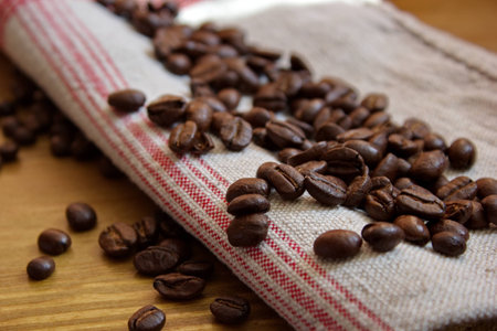 coffee beans on flax tableclothの写真素材