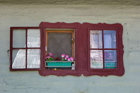 painted window of traditional wooden house Liptov Slovakiaの写真素材