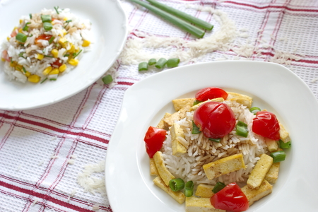 healthy dinner - rice with roasted vegetable and tofu, vegetable risottoの写真素材