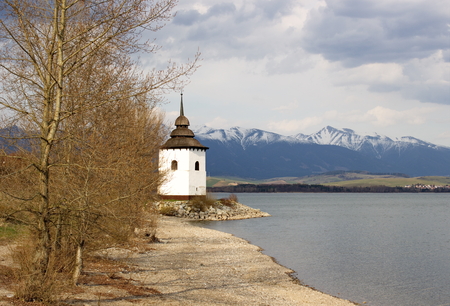 tower of old church on coast of Liptovska Mara, Slovakiaの写真素材