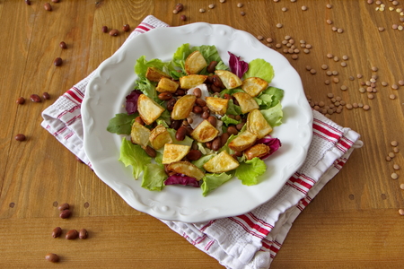 Consists healthy lunch of salad, beans and potatoesの写真素材