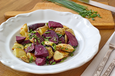 baked beetroot and potatoes with chiveの写真素材