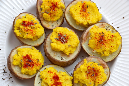 hummus served with baked potatoesの写真素材