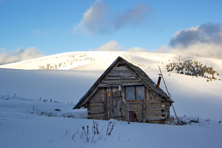 Old mountain hut in winter time, Slovakiaの写真素材